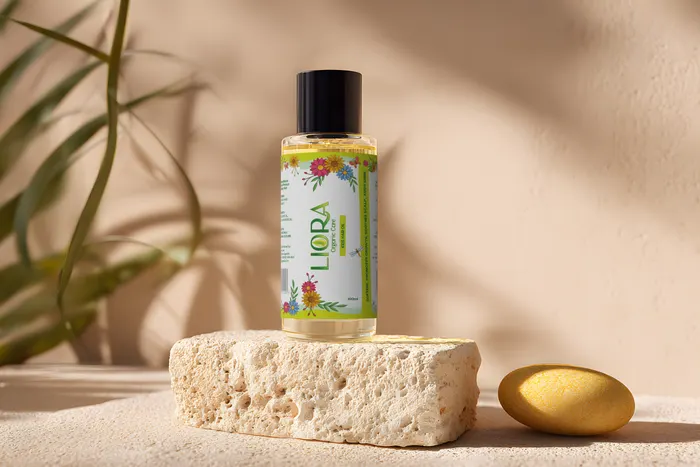 Liora kids hair oil on a sunlit stone